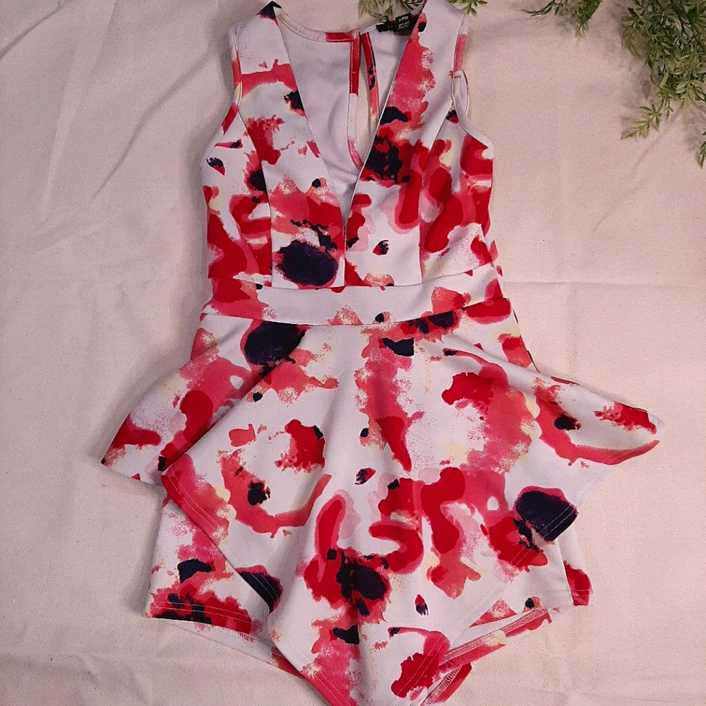 Pink and white peplum romper